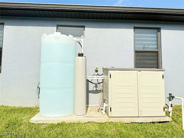 1719 NW 15th St, Cape Coral, FL 33993 - view of property exterior with stucco siding