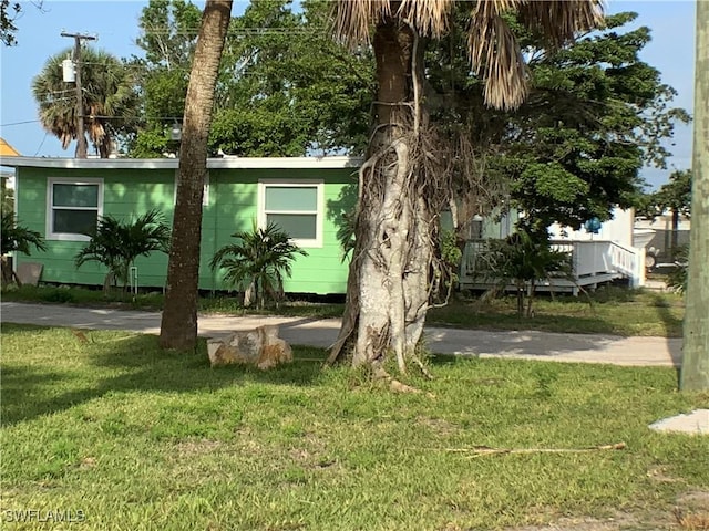 1180 Main St Unit 6, Fort Myers Beach, FL 33931 - view of front of property featuring a front lawn