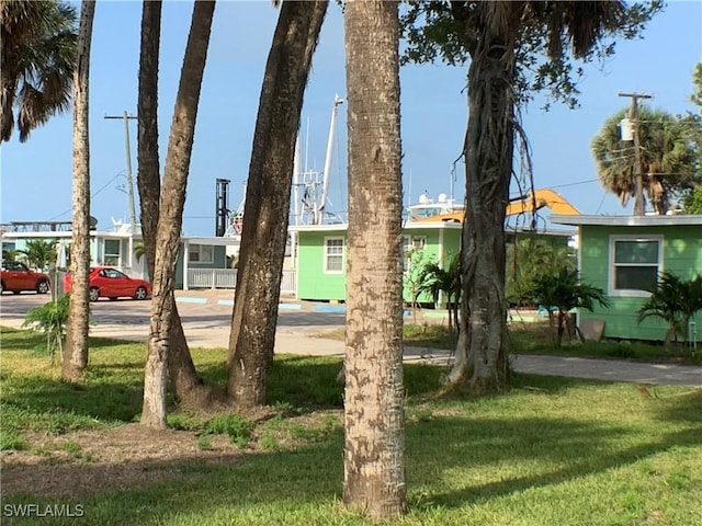 1180 Main St Unit 6, Fort Myers Beach, FL 33931 - view of front of property featuring a front lawn