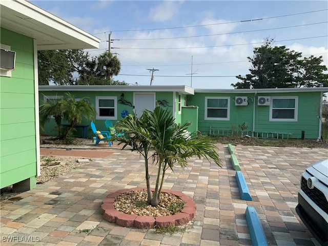1180 Main St Unit 6, Fort Myers Beach, FL 33931 - rear view of property featuring a patio area