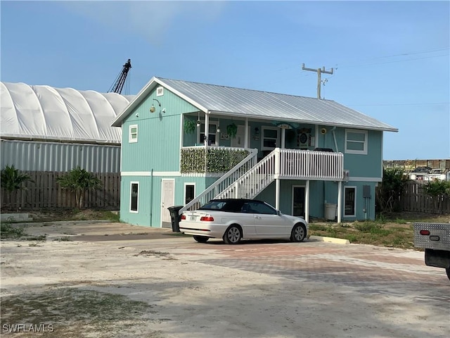 1180 Main St Unit 6, Fort Myers Beach, FL 33931 - view of building exterior featuring stairs