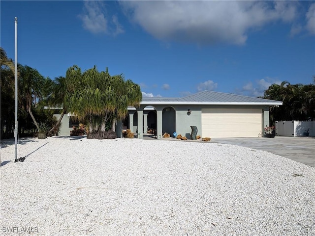 11397 Argentine Ct, Bokeelia, FL 33922 - ranch-style home featuring driveway, stucco siding, and a garage
