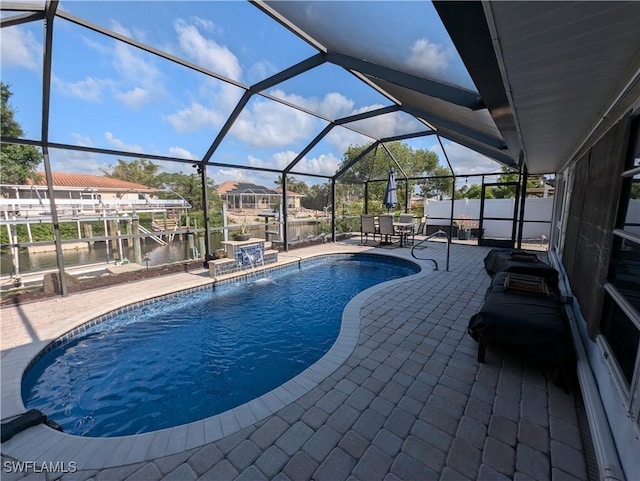 11397 Argentine Ct, Bokeelia, FL 33922 - outdoor pool with a patio area, a water view, and glass enclosure