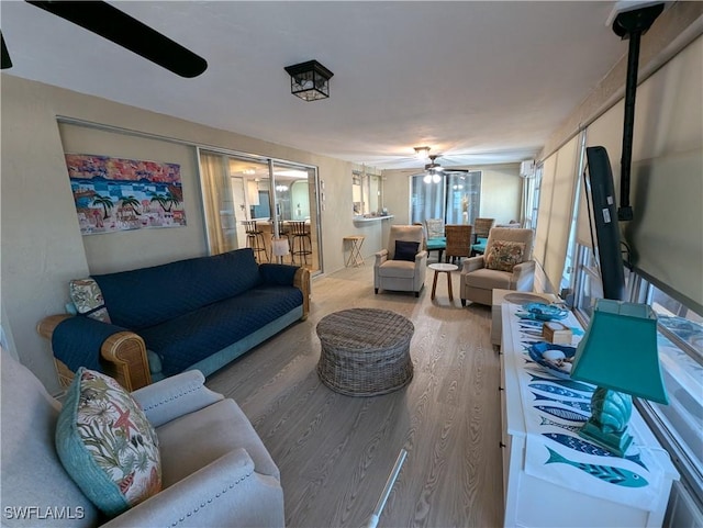 11397 Argentine Ct, Bokeelia, FL 33922 - living area featuring wood finished floors and a ceiling fan
