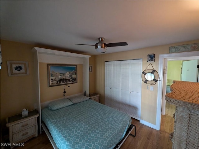 11397 Argentine Ct, Bokeelia, FL 33922 - bedroom featuring wood finished floors, baseboards, a closet, and a ceiling fan