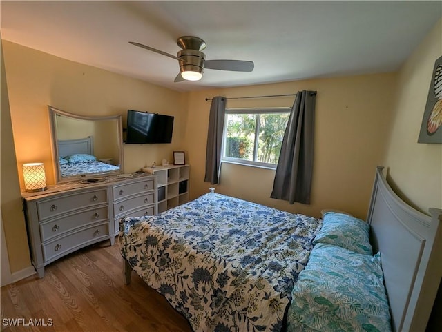 11397 Argentine Ct, Bokeelia, FL 33922 - bedroom with wood finished floors and ceiling fan