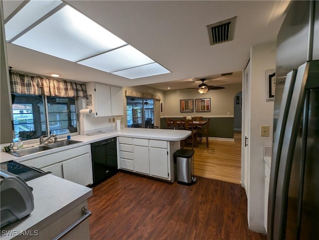 11397 Argentine Ct, Bokeelia, FL 33922 - kitchen featuring black appliances, a sink, light countertops, a peninsula, and a ceiling fan