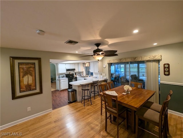11397 Argentine Ct, Bokeelia, FL 33922 - dining area featuring light wood-style flooring, a ceiling fan, baseboards, and recessed lighting