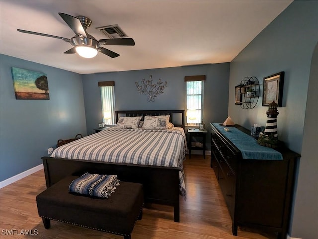 11397 Argentine Ct, Bokeelia, FL 33922 - bedroom with wood finished floors, baseboards, and ceiling fan