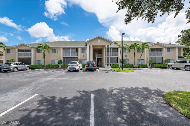 27111 Matheson Ave Unit 103, Bonita Springs, FL 34135 - view of property featuring uncovered parking and a residential view