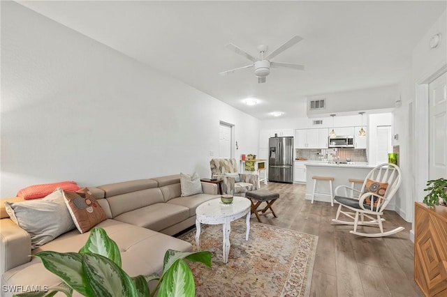 27111 Matheson Ave Unit 103, Bonita Springs, FL 34135 - living room with wood finished floors and a ceiling fan