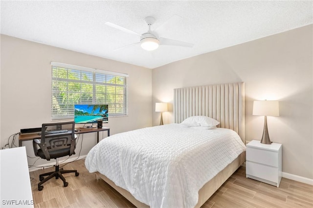 1150 Wildwood Lakes Blvd Unit 203, Naples, FL 34104 - bedroom featuring light wood-style floors, baseboards, an office area, and ceiling fan