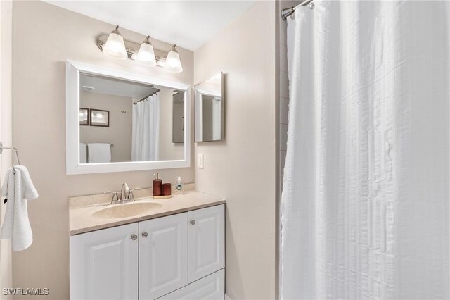 1150 Wildwood Lakes Blvd Unit 203, Naples, FL 34104 - bathroom with vanity and curtained shower