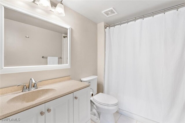1150 Wildwood Lakes Blvd Unit 203, Naples, FL 34104 - full bathroom featuring vanity, toilet, tile patterned flooring, and curtained shower