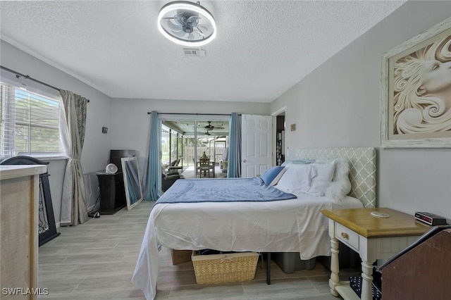 3822 Palm Tree Blvd, Cape Coral, FL 33904 - bedroom with multiple windows and a textured ceiling