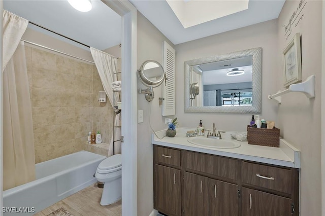 3822 Palm Tree Blvd, Cape Coral, FL 33904 - bathroom with toilet, vanity, shower / tub combo, wood finished floors, and a skylight