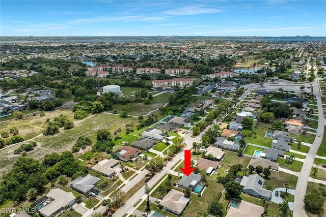 3822 Palm Tree Blvd, Cape Coral, FL 33904 - aerial view of property and surrounding area with nearby suburban area and a large body of water