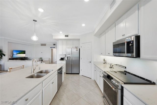 12003 Hawthorn Lake Dr Unit 101, Fort Myers, FL 33913 - kitchen with appliances with stainless steel finishes, a sink, ornamental molding, white cabinetry, and light tile patterned flooring