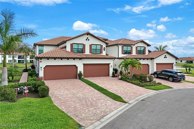 12003 Hawthorn Lake Dr Unit 101, Fort Myers, FL 33913 - mediterranean / spanish-style home featuring stucco siding, decorative driveway, a tile roof, and a front yard