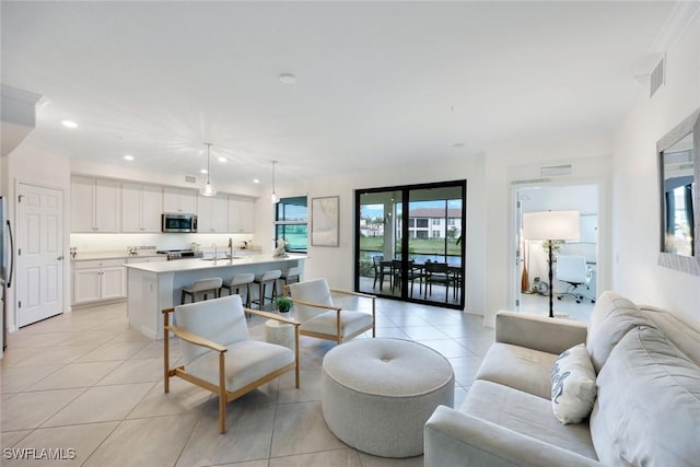 12003 Hawthorn Lake Dr Unit 101, Fort Myers, FL 33913 - living area featuring light tile patterned floors and recessed lighting