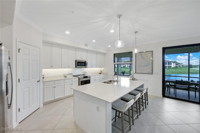12003 Hawthorn Lake Dr Unit 101, Fort Myers, FL 33913 - kitchen featuring appliances with stainless steel finishes, a sink, light tile patterned floors, plenty of natural light, and ornamental molding