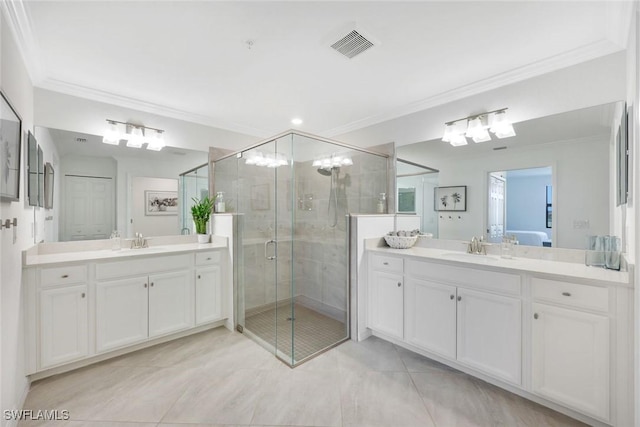 12003 Hawthorn Lake Dr Unit 101, Fort Myers, FL 33913 - full bathroom featuring crown molding, a shower stall, two vanities, and tile patterned flooring