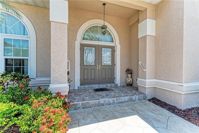 414 Caicos Dr, Punta Gorda, FL 33950 - doorway to property featuring stucco siding and a porch