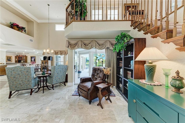 414 Caicos Dr, Punta Gorda, FL 33950 - living room featuring a towering ceiling, a chandelier, light stone finish floors, stairway, and crown molding