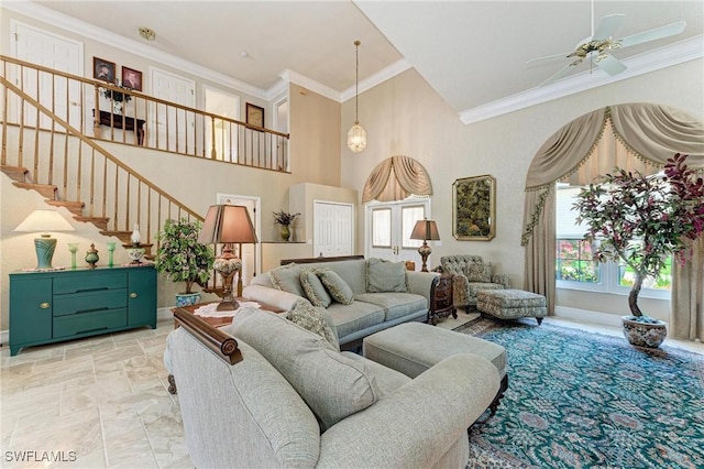 414 Caicos Dr, Punta Gorda, FL 33950 - living area featuring stairs, a ceiling fan, crown molding, a high ceiling, and light stone finish flooring