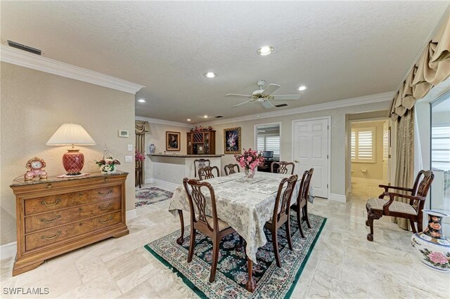 414 Caicos Dr, Punta Gorda, FL 33950 - dining space with crown molding, baseboards, recessed lighting, ceiling fan, and a textured ceiling