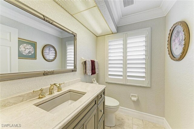 414 Caicos Dr, Punta Gorda, FL 33950 - bathroom featuring crown molding, toilet, vanity, baseboards, and tile patterned floors