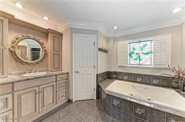 414 Caicos Dr, Punta Gorda, FL 33950 - full bathroom with a garden tub, tile patterned floors, vanity, ornamental molding, and recessed lighting