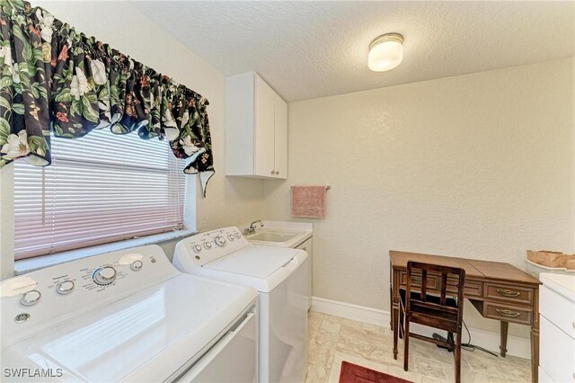 414 Caicos Dr, Punta Gorda, FL 33950 - laundry room with independent washer and dryer, cabinet space, a textured ceiling, and baseboards