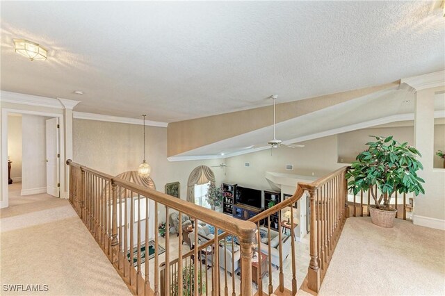 414 Caicos Dr, Punta Gorda, FL 33950 - corridor featuring light carpet, an upstairs landing, crown molding, and baseboards