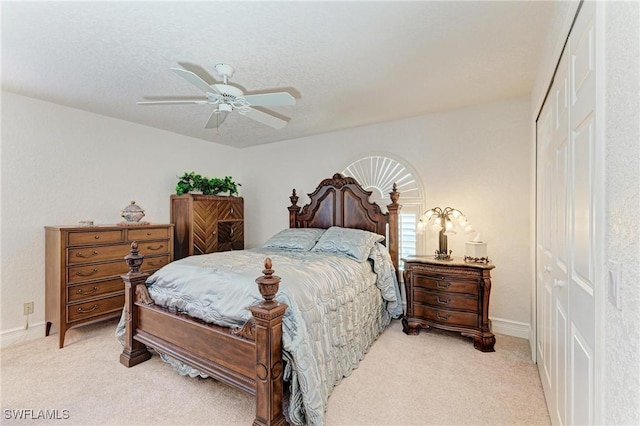 414 Caicos Dr, Punta Gorda, FL 33950 - bedroom featuring a closet, light colored carpet, baseboards, and ceiling fan
