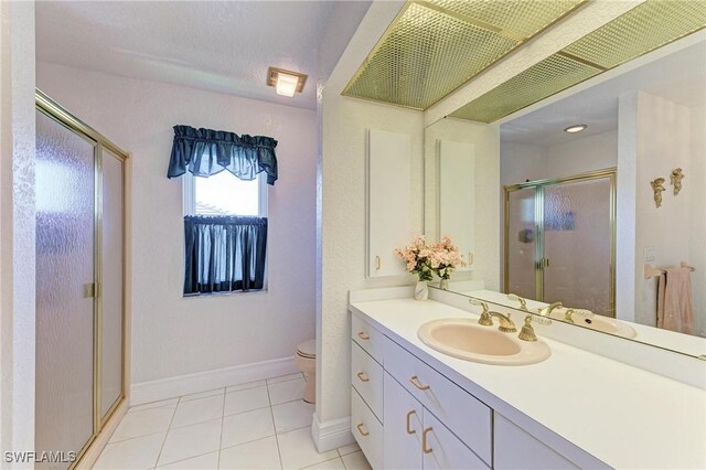 414 Caicos Dr, Punta Gorda, FL 33950 - full bathroom with a shower stall, baseboards, tile patterned flooring, vanity, and toilet