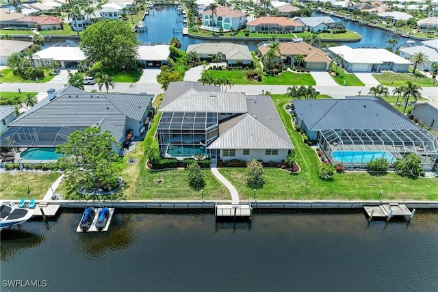 414 Caicos Dr, Punta Gorda, FL 33950 - aerial perspective of suburban area with a nearby body of water and a pool