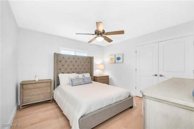 523 107th Ave N, Naples, FL 34108 - bedroom with light wood-type flooring, a closet, ceiling fan, and baseboards