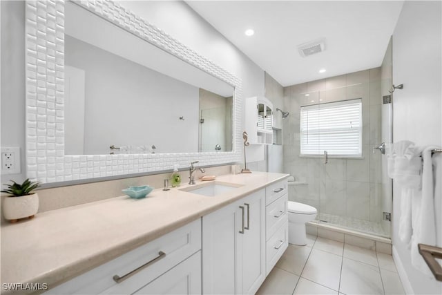 523 107th Ave N, Naples, FL 34108 - bathroom with tile patterned floors, vanity, a stall shower, and toilet