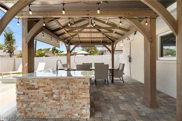 523 107th Ave N, Naples, FL 34108 - fenced backyard with a gazebo and a patio area
