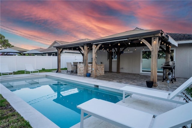 523 107th Ave N, Naples, FL 34108 - view of pool featuring a gazebo, a fenced backyard, grilling area, a diving board, and a patio area