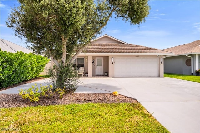523 107th Ave N, Naples, FL 34108 - ranch-style home featuring a garage, stucco siding, and driveway