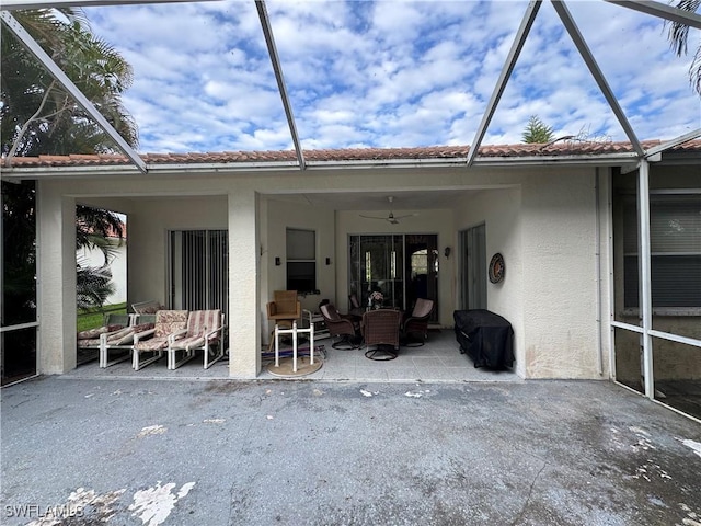 3430 Allegheny Ct, Naples, FL 34120 - rear view of property featuring stucco siding, a lanai, a patio area, and a ceiling fan