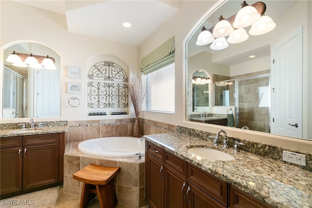 6492 Caldecott Dr, Naples, FL 34113 - bathroom featuring a shower stall, two vanities, a garden tub, and tile patterned flooring