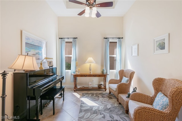 6492 Caldecott Dr, Naples, FL 34113 - sitting room with tile patterned flooring and ceiling fan