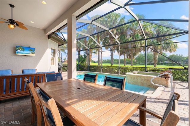 6492 Caldecott Dr, Naples, FL 34113 - view of patio featuring outdoor dining area, a ceiling fan, a pool with connected hot tub, and a lanai