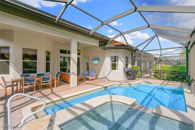 6492 Caldecott Dr, Naples, FL 34113 - swimming pool with a hot tub, a patio, and glass enclosure