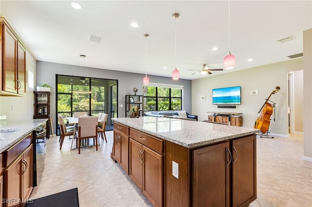 6624 Palmerston Dr, Fort Myers, FL 33966 - kitchen with light tile patterned floors, recessed lighting, a center island, and pendant lighting