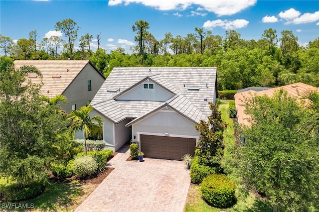 6624 Palmerston Dr, Fort Myers, FL 33966 - view of front of house with stucco siding, an attached garage, and driveway