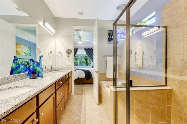 6624 Palmerston Dr, Fort Myers, FL 33966 - full bathroom featuring a ceiling fan, tile patterned flooring, a shower stall, double vanity, and ensuite bathroom